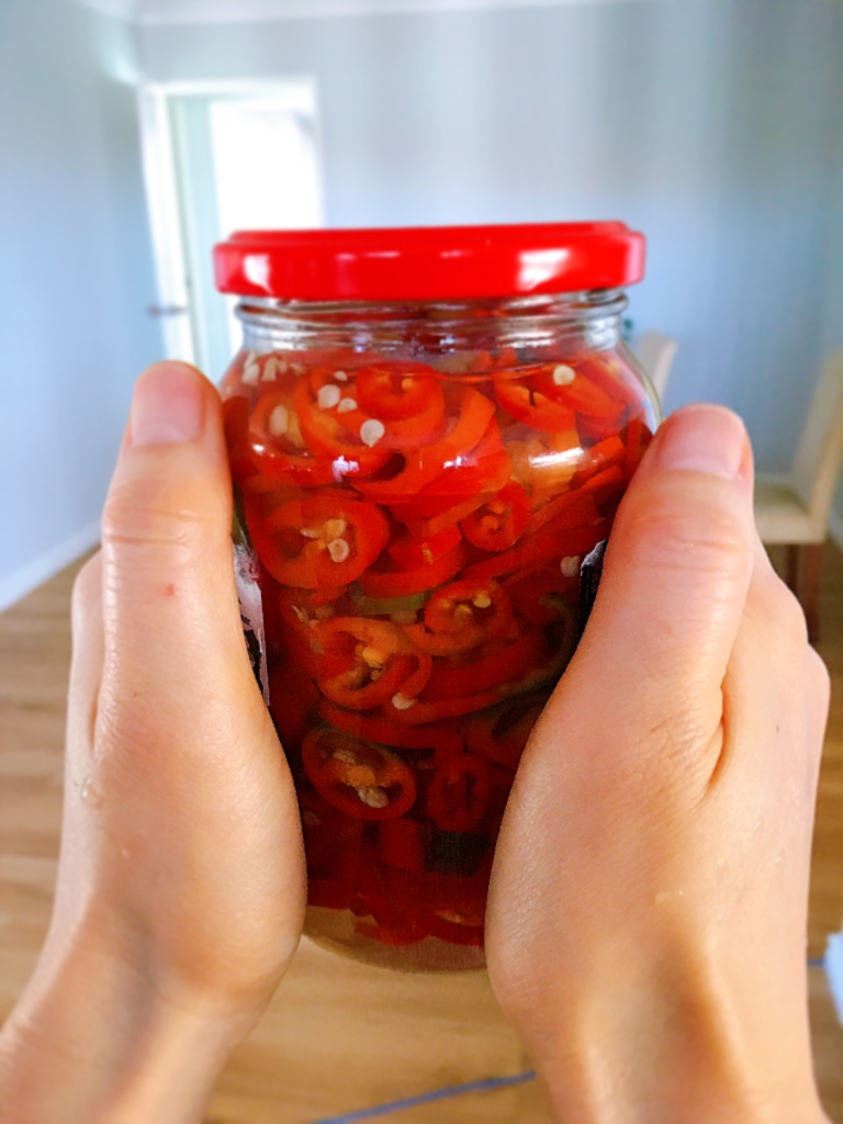 A jar of homemade pickled chillies 